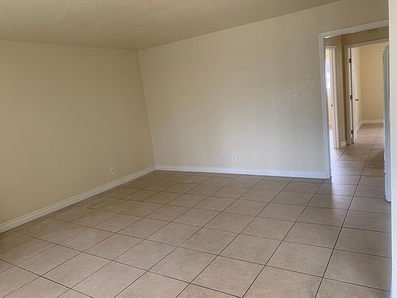 Large living room with a lot of natural light.