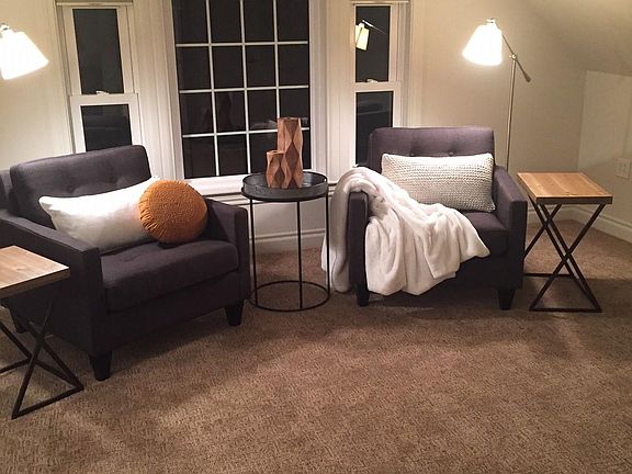 Bedroom sitting area at night.