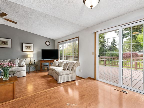 A sliding glass door in the dining nook opens onto the huge rear deck, creating an easy transition between indoor and outdoor areas.