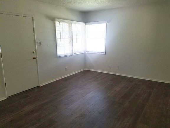 Large Living Room with new wood laminate flooring