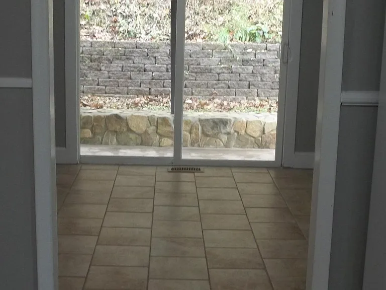 View from kitchen into dinning room. Sliding glass doors lead out to covered back area seen in other outdoor pic