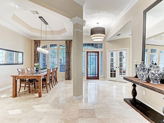 Gorgeous inviting entry in the great one story home with gleaming travertine flooring.