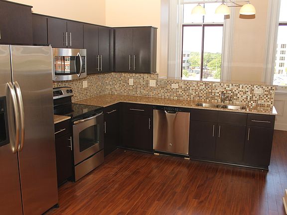 Stainless Steel Appliances and Full Glass Backsplash