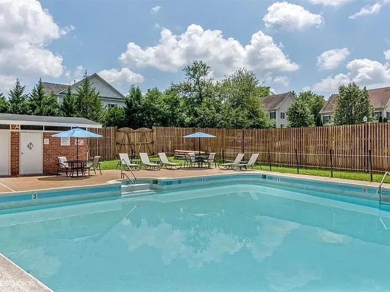 Outside pool with lounge chair