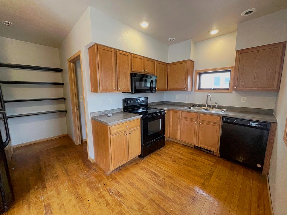 Comfortable living area filled with natural light in this affordable front upper duplex in Antigo.