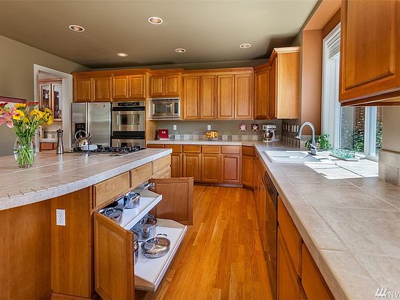 Kitchen has custom pullout shelving throughout