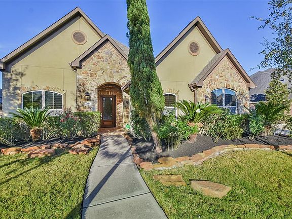 Beautiful freshly updated landscaping and stunning stone elevation!