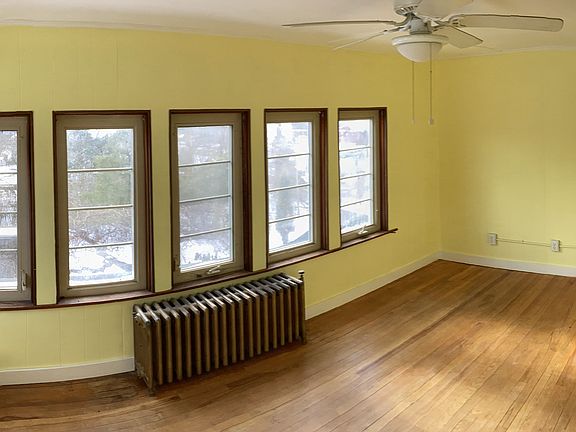 Sunroom at driveway side of house.