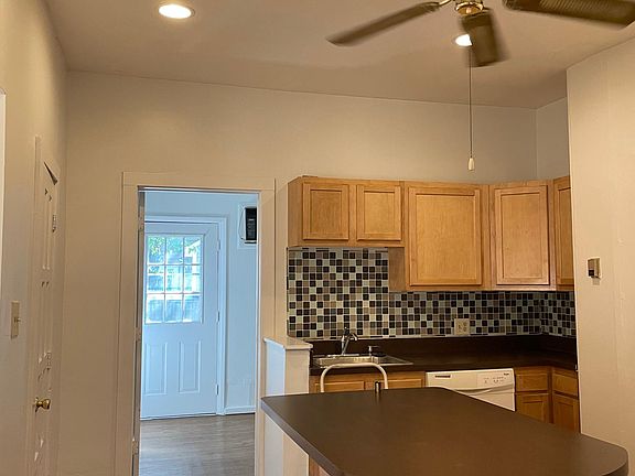 kitchen looking towards back door and laundry room area