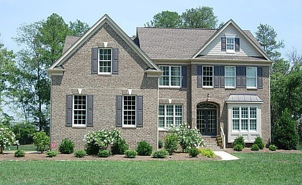 All Brick with 3 car garage & 3rd floor 