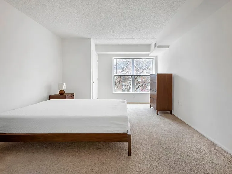 Furnished+ apartment homes feature queen bed with mattress, dresser, nightstands, and lamps (Representative Image exact items and style of furnishings may vary)