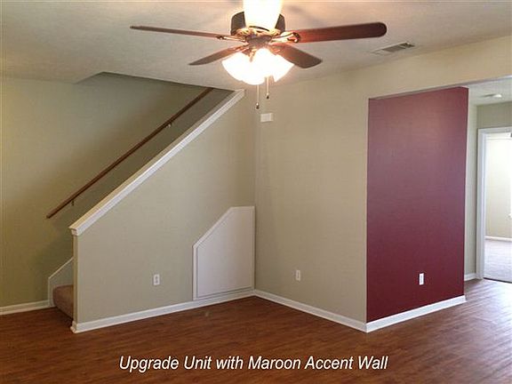 Living/Dining w/ maroon accent wall