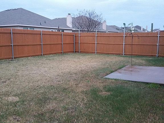 Fenced yard with patio