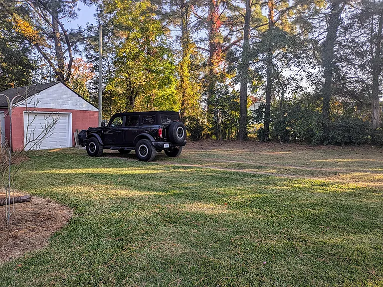 Large backyard with garage