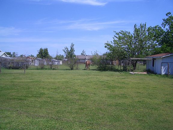 back yard, chicken coop to right