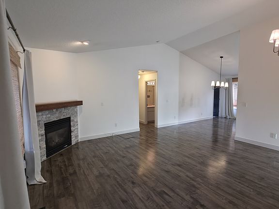 Living Room with Gas Fireplace, Dining Room to the right.