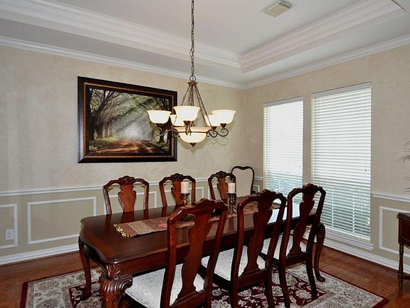 Formal dining is large enough to accommodate seating for 8 or more, and a China cabinet.