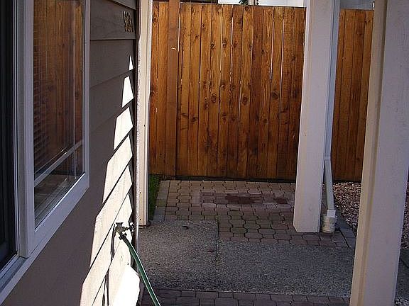 Covered front patio looking toward entry 