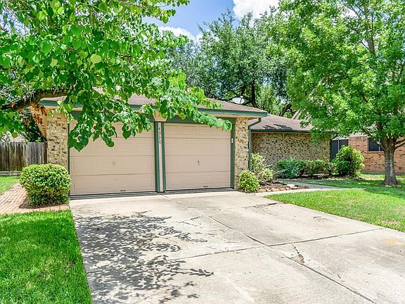 2 car garage with wide driveway.