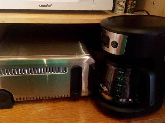 Toaster/pizza oven with microwave and coffee maker