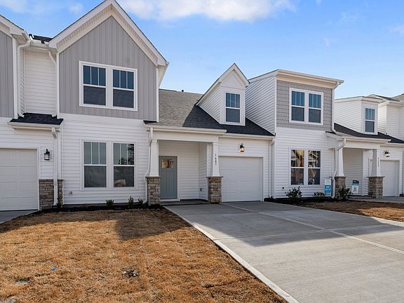 2 story townhome with, 1 car garage, 2 car parking pad, vaulted ceilings, owner s on main and patio