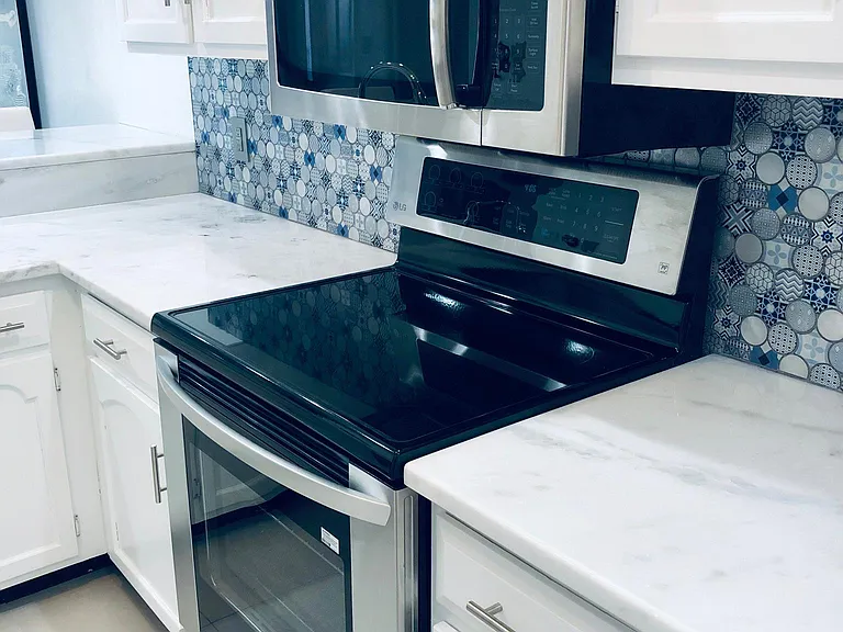 Stainless Steel Stove and Microwave.