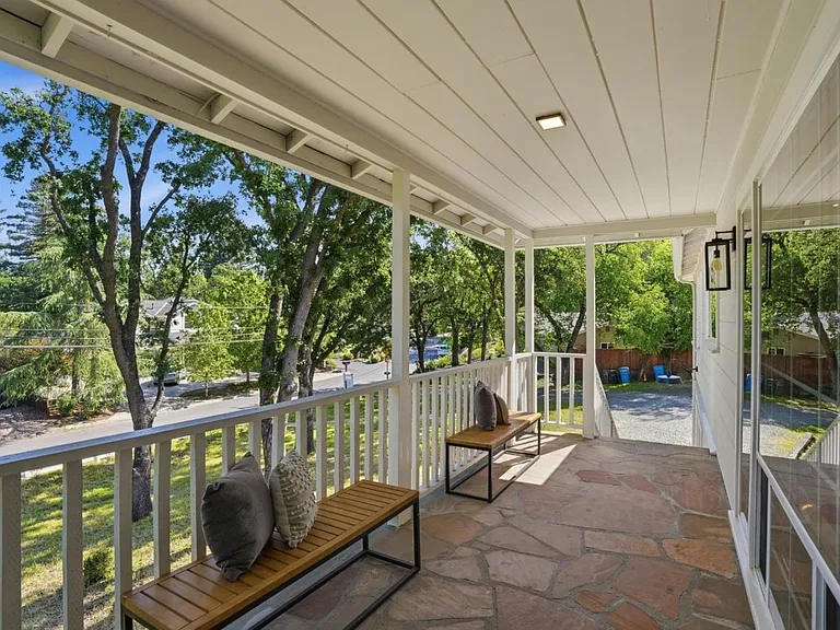 Covered front porch with tranquil neighborhood views