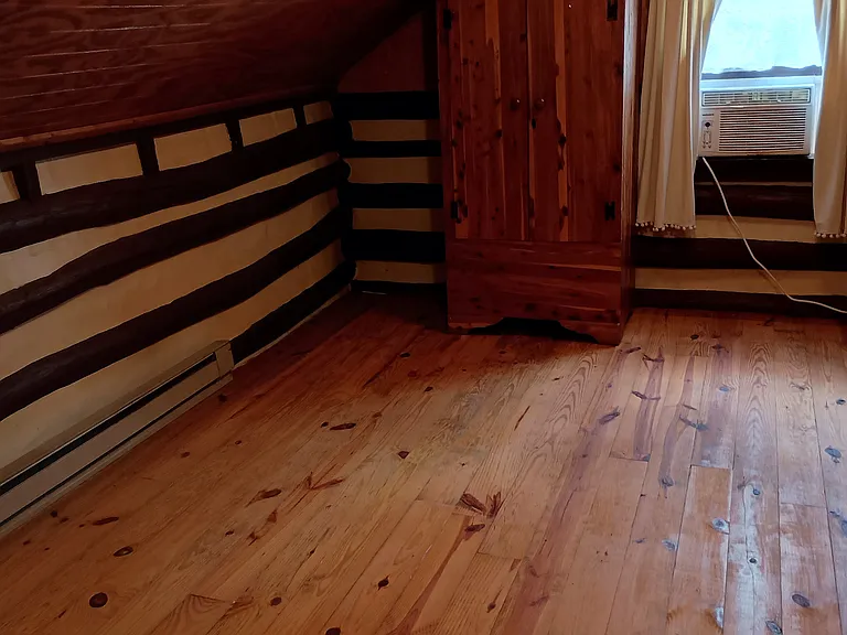 Bedroom with armoire.