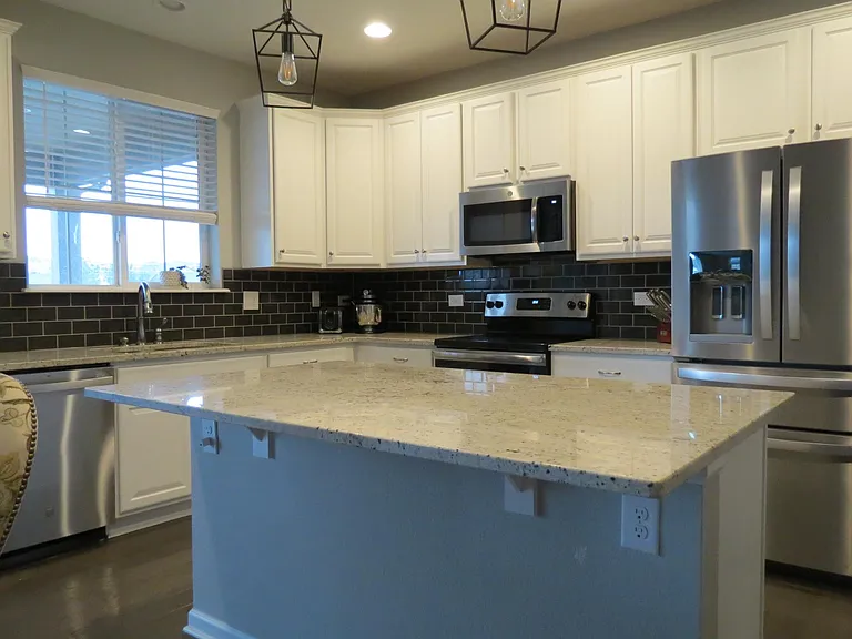 Kitchen with stainless steel appliances, electric stove