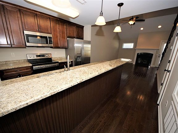 Kitchen with Breakfast Bar opens to Great Room