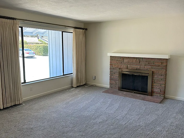 Living Room , Lots of light and wood burning fireplace