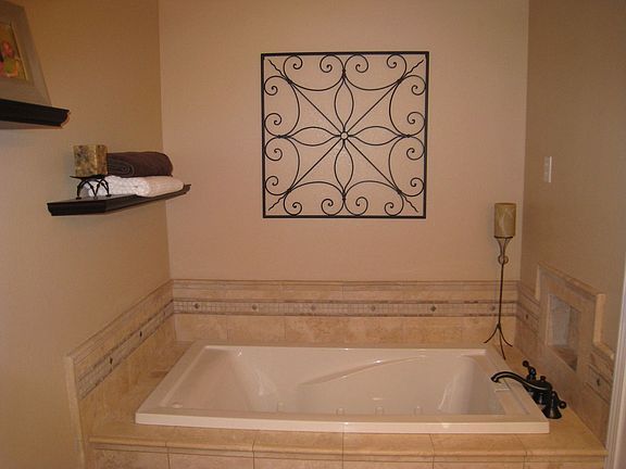 Master bath has double sinks and separate tiled shower and jetted soaking tub!