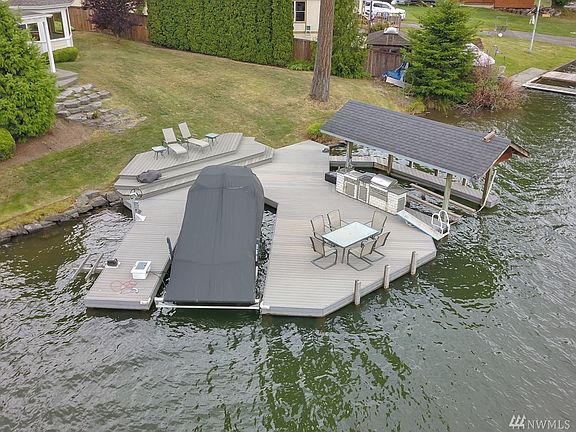 Mechanic's Dream Garage/Shop!  32 Air Compressor Hook-Ups, Generator Transfer Switch, Electric Car Charging Station & 16 X 9 Interior Storage above garage bay with retractable cat-walk for access.