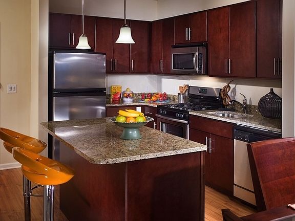 Spacious kitchen with granite countertops and stainless stee