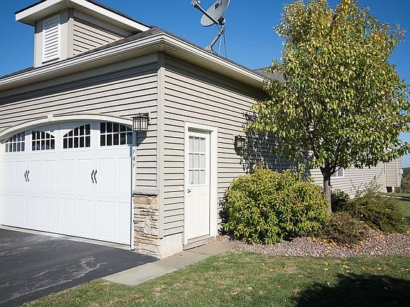 EXTERIOR FRONT - 2 CAR GARAGE WITH SIDE DOOR LEADS TO EXTRA LARGE SIDE YARD & BACK YARD - GREAT FOR ENTERTAINING !!!