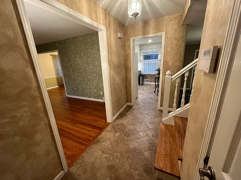 Living room to the left and sunken Den to the right