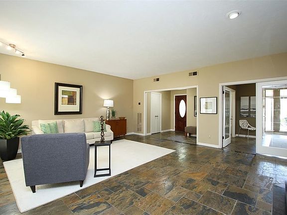 The centerpiece of the home is the large family room which is open to the dinning area as well as the study. Slate floors are throughout the downstairs living area.