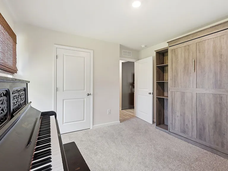 Second Angle of Guest Room. Murphy Bed with shelves will stay (mattress not included).