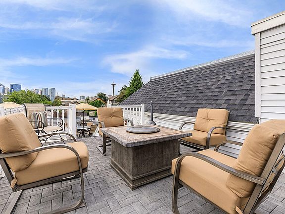 Relax and unwind on this elegant rooftop terrace with stunning city views.
