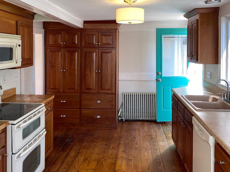 Kitchen includes dishwasher, range, microwave, storage