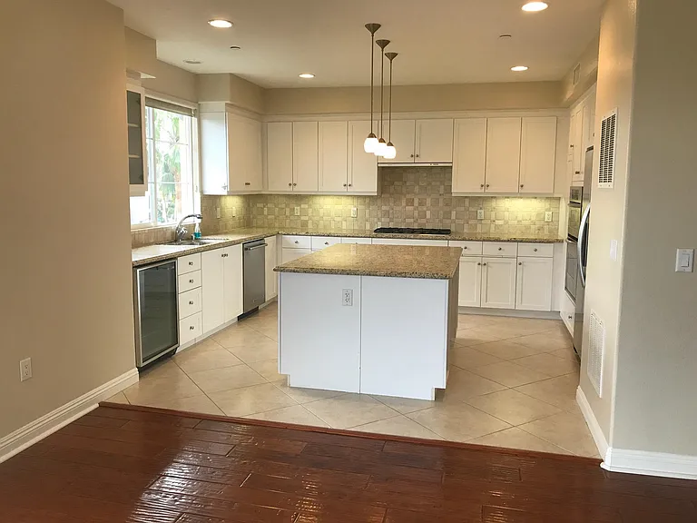 Kitchen with with stainless steel appliances and wine fridge