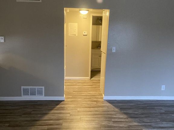 Hallway view to bedrooms, hall bathroom.