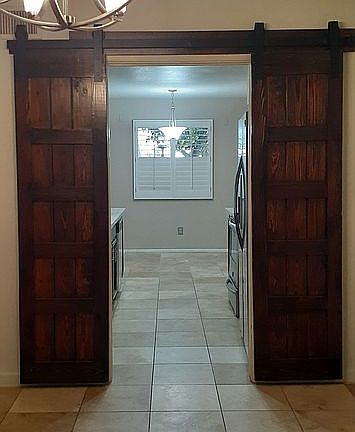 Dual barn door kitchen entry