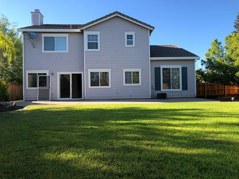 Rear view of the house from backyard