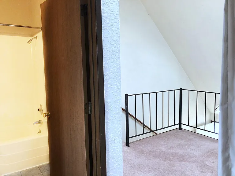 Loft bedroom with attached bathroom