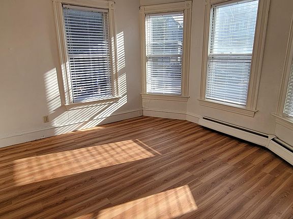 Living room tons of natural light 9ft ceilings and pockets doors