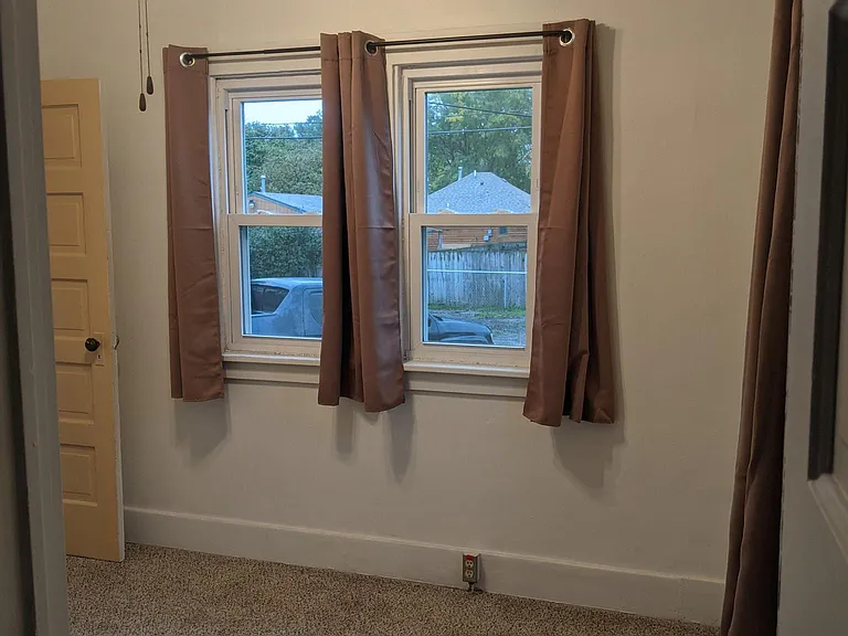 Bedroom #1, adjacent to kitchen. Connects to bedroom #2. Perfect for a nursery!