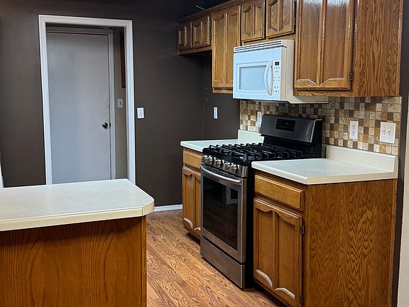 Kitchen - new stainless steel microwave being installed