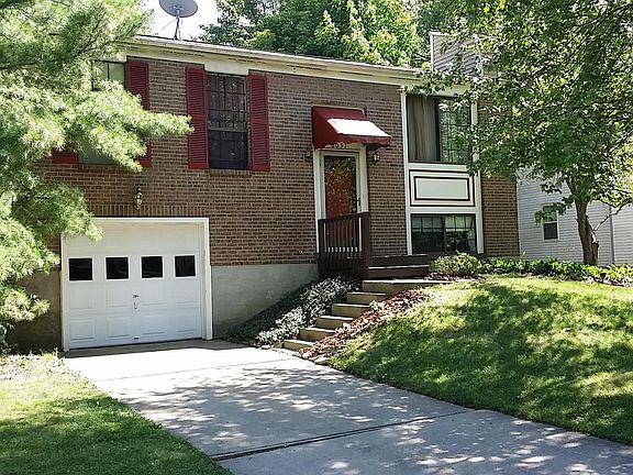 Front of house with garage.