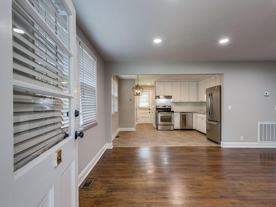 View of the living room and eat-in kitchen upon entering the front